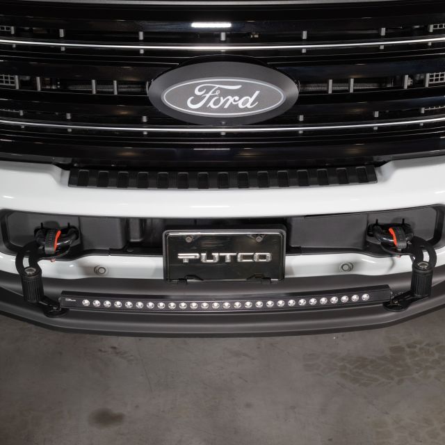 Denominator mounting point adjusted out to accept Curved light bar.