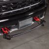 LED light bar mount brackets are properly installed on the front bumper of a Chevy truck.