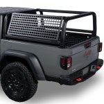 Black Venture Tec MOLLE mounting panel on a tubular rack in the bed of a gray Jeep Gladiator