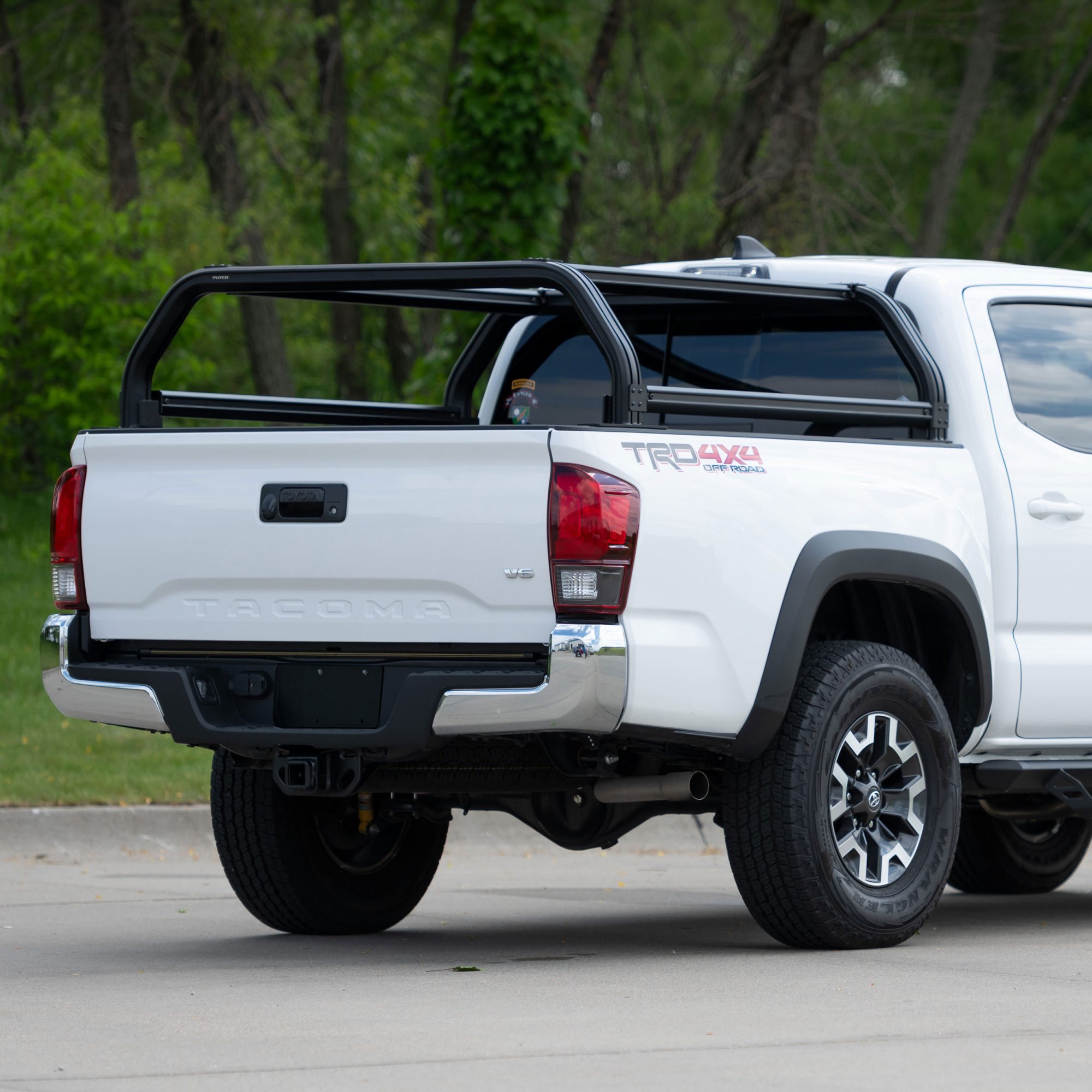 Toyota Tacoma equipped with a Putco Venture TEC truck bed rack